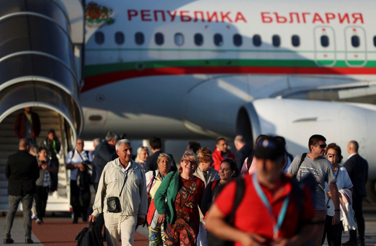 People evacuated from Israel on a Bulgarian government plane arrive at Sofia International Airport, in Sofia, Bulgaria, October 8, 2023. REUTERS/Spasiyana Sergieva