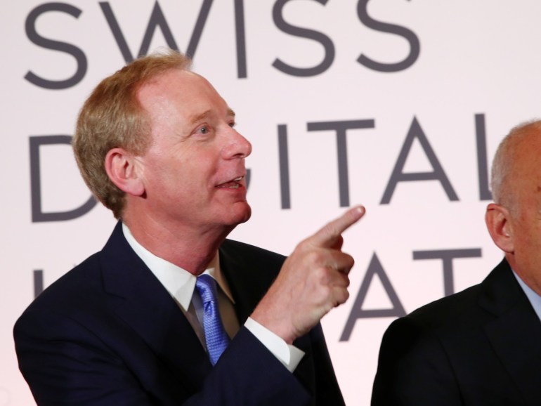 Microsoft Chairman Brad Smith and Swiss President Ueli Maurer wait for a news conference after the Swiss Global Digital Summit in Geneva, Switzerland, September 2, 2019. REUTERS/Denis Balibouse