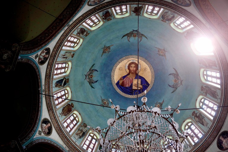 A painting of Jesus Christ on the ceiling of St. George Church in Old Cairo, Egypt, Tuesday, Aug. 30, 2016. After long hoping for an end to restrictions on the building of churches, many of Egypt's Christians are infuriated and feeling betrayed after lawmakers on Tuesday passed a law giving authorities broad powers to veto construction for vague reasons including worries over 'national security.' (AP Photo/Nariman El-Mofty)