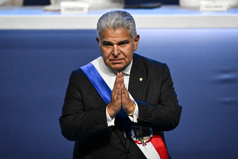 Panama's new President Jose Raul Mulino gestures during his inauguration ceremony at the Atlapa Convention Center in Panama City on July 1, 2024. Right-wing Jose Raul Mulino assumes the presidency of Panama with the promise to stop, with the help of the United States, the passage of migrants through the dangerous Darien jungle and to revive the Panamanian economy dependent on the interoceanic canal. (Photo by MARTIN BERNETTI / AFP)