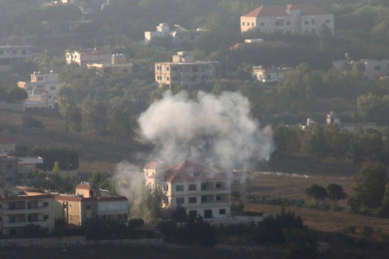 Smoke rises from the southern Lebanese town of Khiam, amid ongoing cross-border hostilities between Hezbollah and Israeli forces, as pictured from Marjayoun, near the border with Israel, August 25, 2024. REUTERS/Karamallah Daher