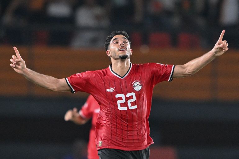 Egypt's forward #22 Omar Marmoush celebrates scoring his team's first goal during the Africa Cup of Nations (CAN) 2024 group B football match between Egypt and Ghana at the Felix Houphouet-Boigny Stadium in Abidjan on January 18, 2024. (Photo by Issouf SANOGO / AFP)