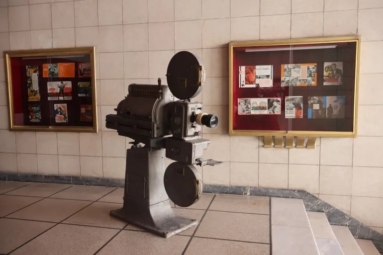 An old film projector from the glory days of Moroccan cinema stands at the entrance to Cinema Lutetia in Casablanca [Amelia Dhuga/Al Jazeera]