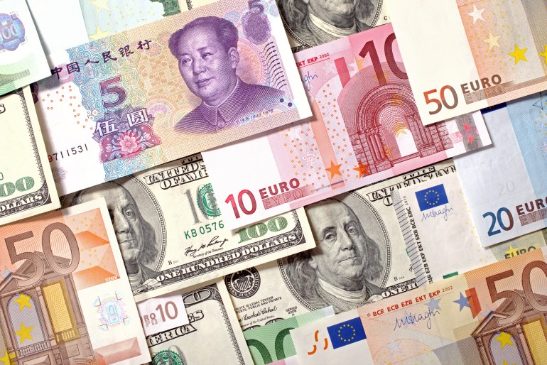 American, European and Chinese banknotes background. Dollars, Euro and Yuan currencies