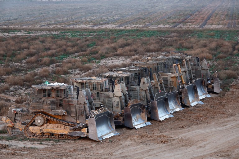 D9 bulldozers are parked near the Israel-Gaza border, amid the ongoing conflict between Israel and Palestinian Islamist group Hamas, in Southern Israel, March 2, 2024. REUTERS/Amir Cohen