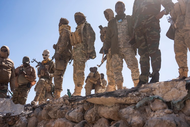 DAABDAMALE, PUNTLAND, SOMALIA - JANUARY 25: Soldiers with the Puntland Defense Forces spend time at a former Islamic State stronghold that they recently took back on the frontline near Daabdamale, Puntland, Somalia on January 25, 2025. Islamic State in Somalia recruits foreign fighters and brings them into Somalia to try to gain ground in what is becoming a key nerve center for the Islamic State. (Photo by Carolyn Van Houten/The Washington Post via Getty Images)