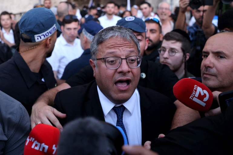 Israel's National Security Minister Itamar Ben-Gvir joins Jewish nationalists, including far-right activists, rallying at Jerusalem's Damascus Gate on June 5, 2024 during the so-called Jerusalem Day flag march, that commemorates the Israeli army's capture in the 1967 Arab-Israeli war of the city's eastern sector, home to the Al-Aqsa mosque compound, Islam's third holiest site, which Jews call the Temple Mount. (Photo by Menahem KAHANA / AFP)