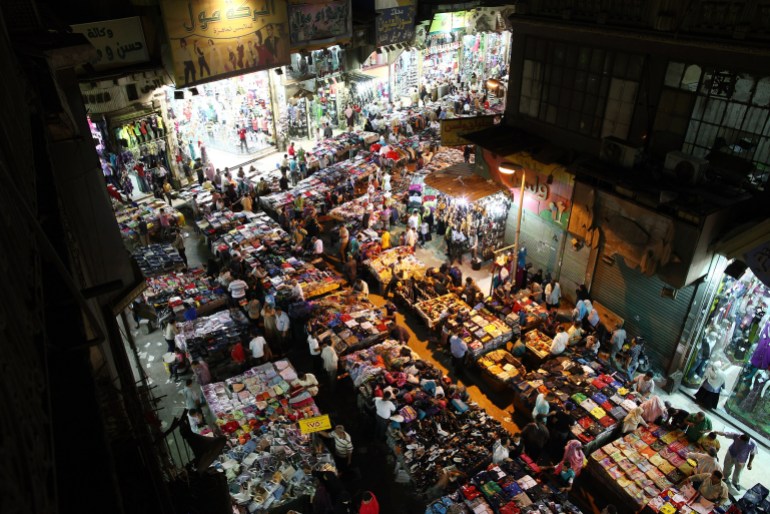 CAIRO, EGYPT - MAY 28: Shoppers move among tables containing clothes and shoes at Ataba market on May 28, 2011 in Cairo, Egypt. Protests in January and February brought an end to 30 years of autocratic rule by President Hosni Mubarak who will now face trial. Food prices have doubled and youth unemployment stands at 30%. Tourism is yet to return to pre-uprising levels. (Photo by Peter Macdiarmid/Getty Images)