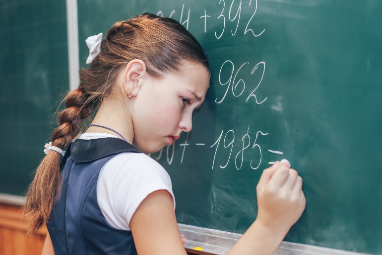 The schoolboy at the blackboard can not solve the problem. Problems with know in school; Shutterstock ID 791512843; purchase_order: aljazeera ; job: ; client: ; other: