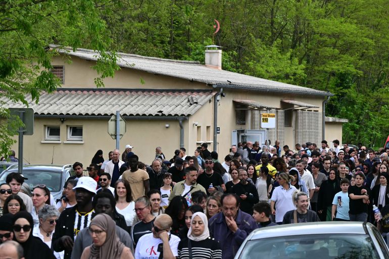 People march outside the mosque Khadija in La Grand-Combe, southern France, on April 27, 2025, following the murder of Aboubakar, a worshipper killed by several dozens of stab wounds inside the mosque on April 25.