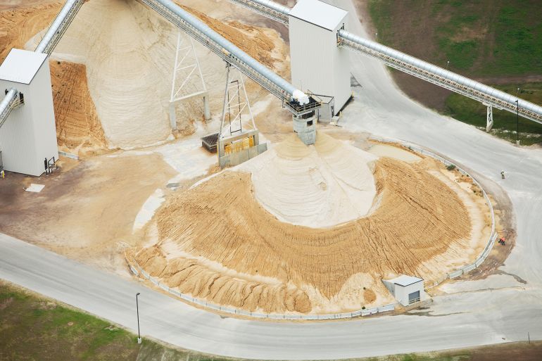This is an aerial view of a northwestern Wisconsin frac sand processing operation. Large piles of sand have been deposited by enclosed conveyors. Shot from the open window of a small plane.
http://www.banksphotos.com/LightboxBanners/Aerial.jpg