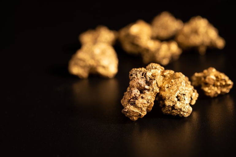 The pure gold ore found in the mine on black background