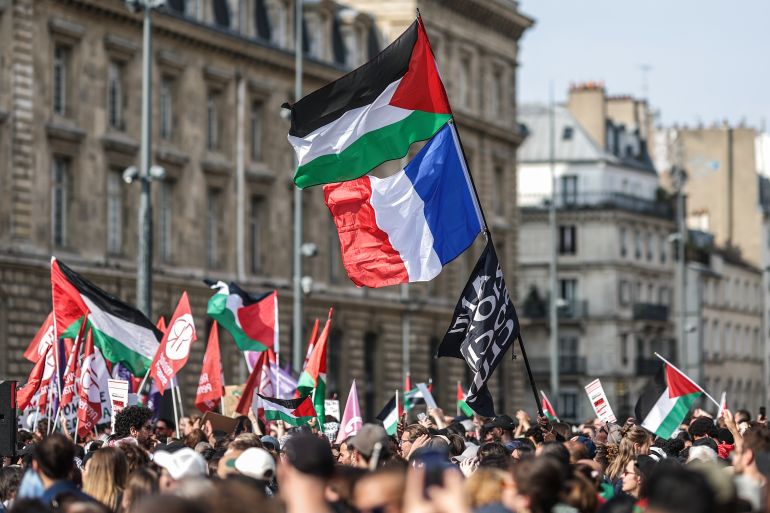 epa12166753 Demonstrators wave Palestinian and French flags during a solidarity rally for Gaza and Palestine at the Place de la Republique in Paris, France, 09 June 2025. La France Insoumise organizes a protest against Israel’s interception of the Freedom Flotilla and the arrest of 12 humanitarians, including French MEP Rima Hassan and climate activist Greta Thunberg. The FFC stated its Gaza-bound Madleen ship, carrying a small shipment of humanitarian aid, was forcibly intercepted by the Israeli military in international waters on 09 June 2025. EPA-EFE/MOHAMMED BADRA