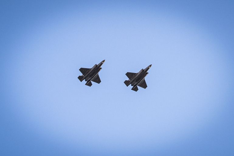 epa12073005 Two Danish F-35 fighter jets fly over as the Danish government marks the 80th anniversary of Denmark's liberation, at Kastellet in Copenhagen, Denmark, 04 May 2025. EPA-EFE/EMIL NICOLAI HELMS DENMARK OUT