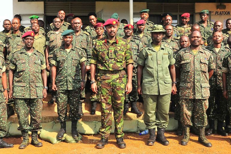 This photo taken on August 27, 2012, shows Brigadier Muhoozi Kainerugaba (C), new commander of the Ugandan Special Forces Command, at the Sera Kasenyi training centre for Special Forces in Kampala on August 16, 2012. The Special Forces Group (SFG), has been restructured and divided into Special Forces One and Special Forces Two. Kainerugaba was promoted to the rank of Commander on August 27, 2012, and his father is current Ugandan President Yoweri Museveni. Analysts have speculated that Kainerugaba's promotion is a step towards a future role as his father's successor. AFP PHOTO / Ronald Kabuubi (Photo by Ronald Kabuubi / AFP)