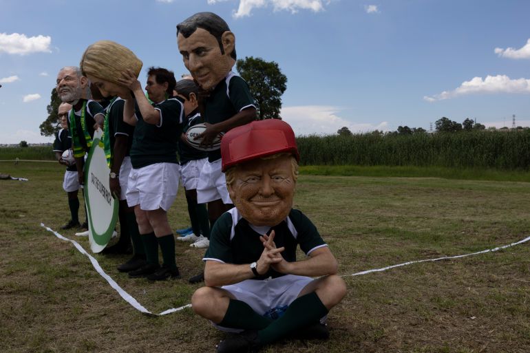 epaselect epa12541796 Members of Oxfam wearing world leaders masks take part in a demonstration in Soweto, Johannesburg, South Africa, 22 November 2025. Referencing Brazilian President Lula da Silva, US President Trump, Italian Prime Minister Meloni, Mexican President Sheinbaum, French President Macron, South African President Ramaphosa, Canada’s Prime Minister Carney, German Chancellor Merz and British Prime Minister Starmer, the demonstration urges world leaders to unite in demanding higher taxes on the super-rich. It comes ahead of the 22–23 November 2025 G20 summit, which will gather 42 participating countries including G20 members (minus the U.S.), guest nations and representatives of regional economic blocs. EPA/KIM LUDBROOK