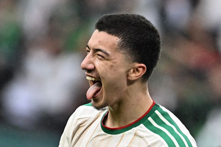 Algeria's midfielder #22 Ibrahim Maza celebrates scoring his team's third goal during the Africa Cup of Nations (CAN) Group E football match between Equatorial Guinea and Algeria at Moulay Hassan Stadium in Rabat on December 31, 2025.